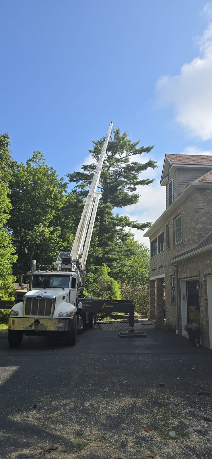 Crane on site with outriggers down, ready to lift.